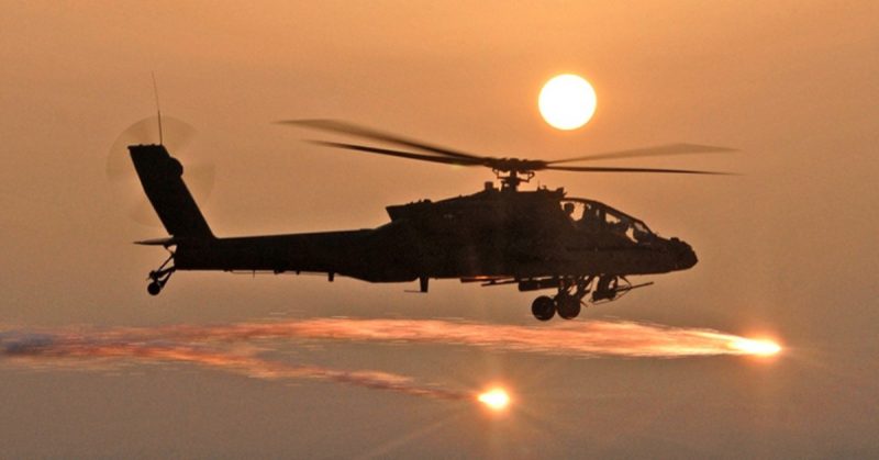 An AH-64D Apache helicopter fires flares as Soldiers from the 227th Aviation Regiment, 1st Air Cavalry Brigade, 1st Cavalry Division, based at Camp Taji, conduct a mission in Iraq, April 2007.