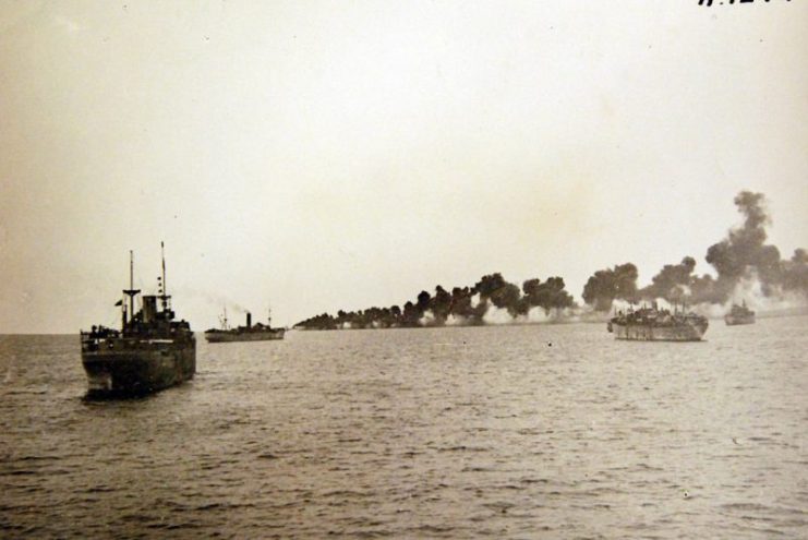 Operation Torch, November 1942. Algiers occupied by Allies. Royal Navy destroyers laying a protective smoke screen round the transports off Algiers.