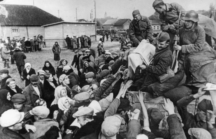 Red Army soldiers distributing the Soviet propaganda newspapers to peasants near Wilno (Vilnius) in Soviet occupied part of Poland.
