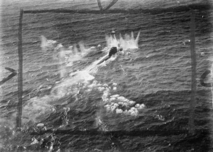 A German type XXI submarine, U-2502, comes under cannon fire from a De Havilland Mosquito FB Mark VI during an attack on four surfaced U-boats and an M-class minsweeper escort in the Kattegat by 22 Mosquitos of the Banff Strike Wing. U-2502 received only slight damage, but a type VIIC submarine was sunk, a type XXIII seriously damaged and the minesweeper left burning.