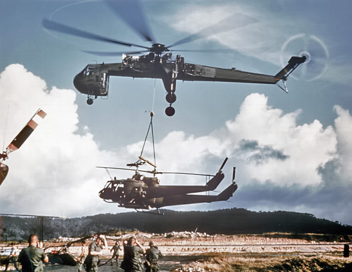 A CH-54A Tarhe carrying 2 UH-1 Hueys.