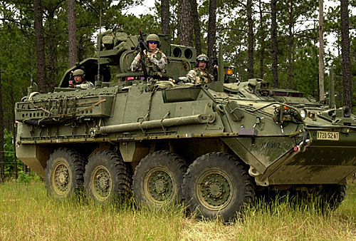 Soldiers from Battery B, 4th Battalion 11th Field Artillery Regiment patrol the entrance of Suliyahi Sabina Site in a Stryker.