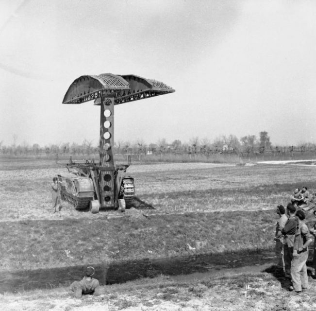 A Churchill bridge layer of 51st Royal Tank Regiment in action during a demonstration in the Mezzano area, 30 March 1945.