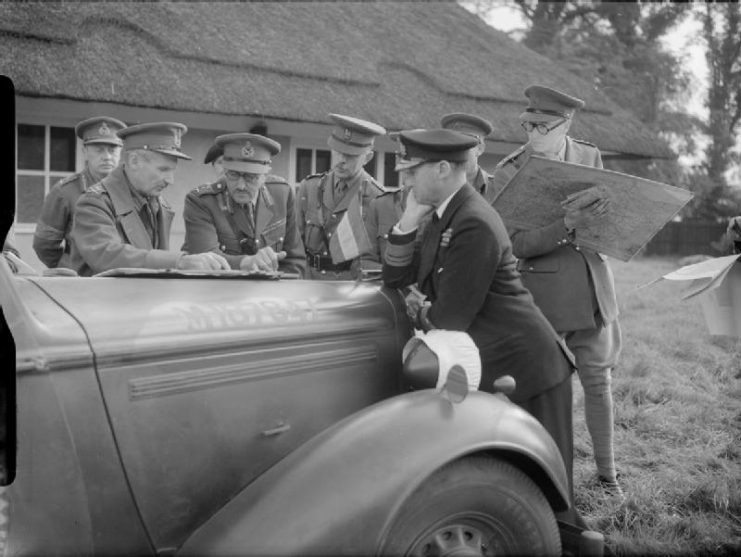 Senior officers discuss operations during Exercise ‘Bumper’, 2 October 1941. On the left the Chief Umpire, Lieutenant-General Bernard Montgomery, talks to the C-in-C Home Forces, General Sir Alan Brooke