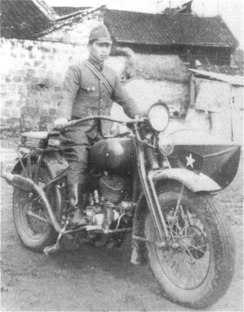 Japanese soldier sitting on a Type 97 motorcycle