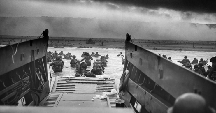 Soldiers of the 10th Infantry Regiment, US 1st Infantry Division attacking the beaches of Normandy on D-Day – June 6, 1944