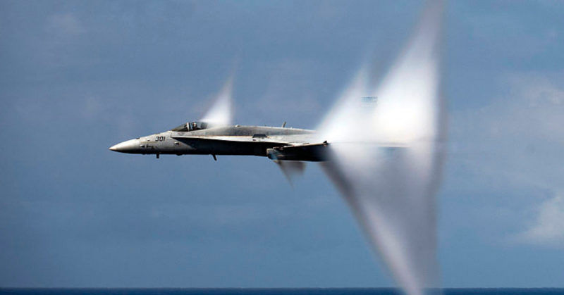 An F/A-18C Hornet in transonic flight producing flow-induced vapor cone