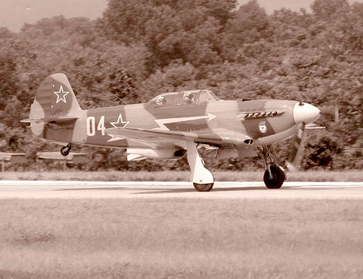 WWII era Soviet Yak-9 on take off at the Mid Atlantic Air Museum WWII Weekend Air Show, 2002.