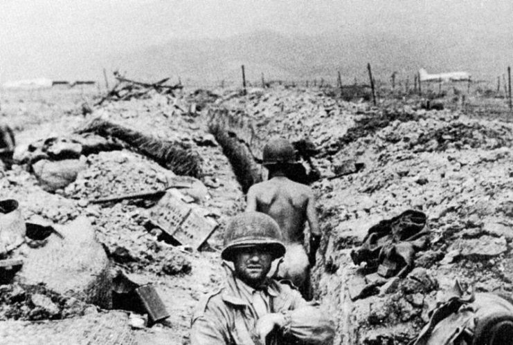 French troops seeking cover in trenches.