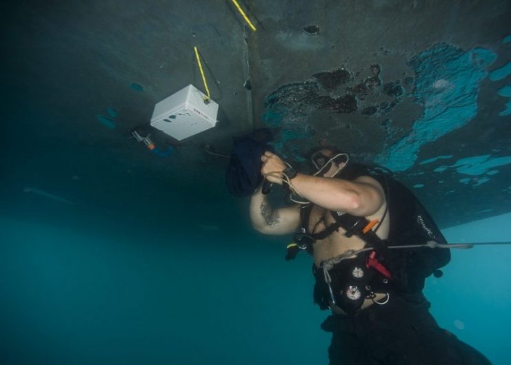 EOD2 Nate Karls, assigned to Explosive Ordnance Disposal Mobile Unit 8, defuses a simulated limpet mine in the Mediterranean Sea during Exercise Noble Melinda 2017