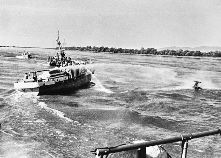 A Soviet ship uses a water cannon against a Chinese fisherman on the Ussuri River on 6 May 1969
