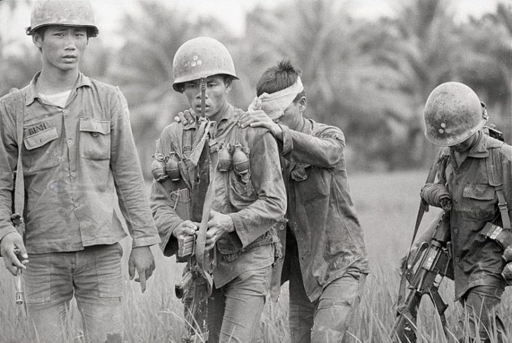 Ben Tre, South Vietnam- A grim-faced member of South Vietnam’s 7th division leads a blinded buddy back to their command post after tangling with a large Viet Cong unit in the Mekong Delta, 65 miles southwest of Saigon. — Image by Bettmann/CORBIS. Photo: manhhai CC BY 2.0
