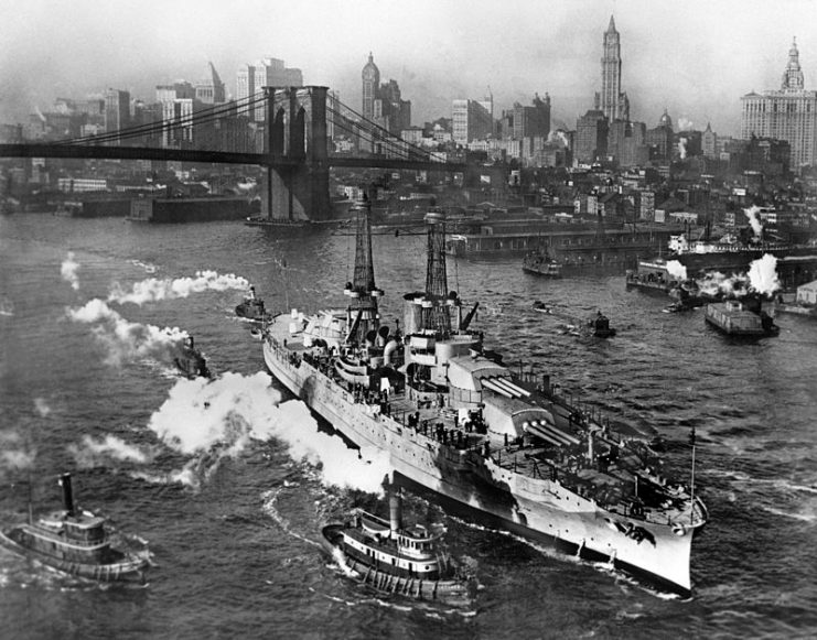View of USS ARIZONA taken from Manhattan Bridge on the East River in New York City on its way back from sea trials. December, 1916.