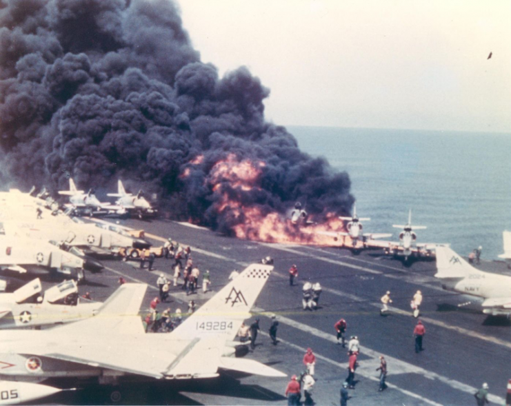 An A-4 Skyhawk burns shortly after its fuel tank was struck by a Zuni missile.