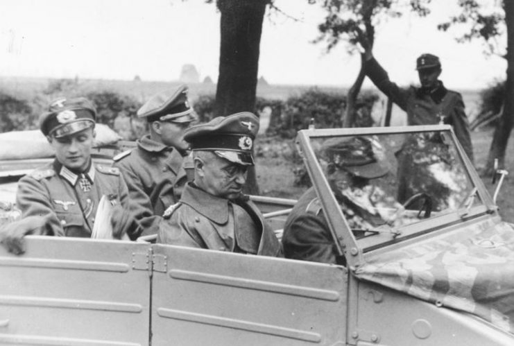 Field Marshal Model visits the advanced Gef.Std. the (246th) Volksgrenadier Division deployed in and around Aachen. The pictures show the Field Marshal with the Div.Kdr., Colonel Wilk in front of the Gef.Std housed in a Westwall bunker. (just before a direct hit on it) and with the I / A of the division.