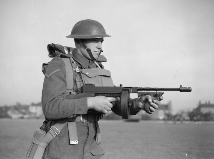 A British soldier equipped with a Thompson M1928 submachine gun (drum magazine), November 25, 1940