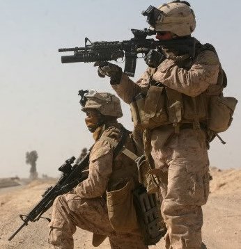 A Marine Corporal and Lance Corporal of 3rd Battalion, 6th Marines engaging the enemy during Operation Moshtarak in Afghanistan