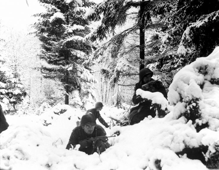 American infantrymen of the 290th Regiment fight in fresh snowfall