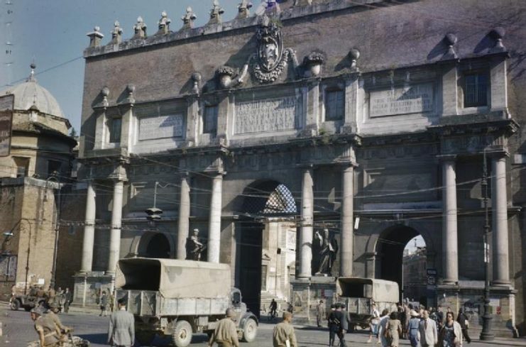 British trucks entering the Piazza del Popolo through the Porta del Popolo (formerly Porta Flaminia) in Rome.