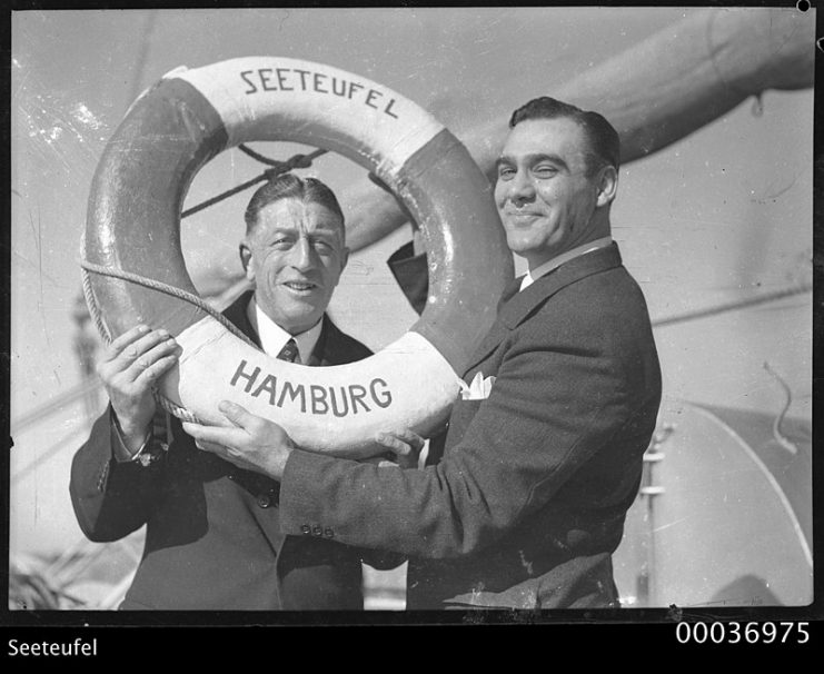 Count Felix Graf von Luckner and an unidentified man holding a life belt on SEETEUFEL