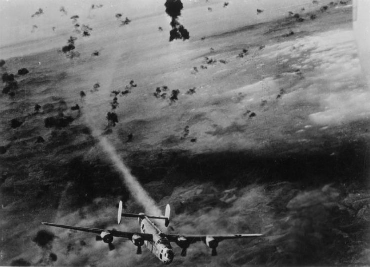 A B-24 Liberator of the 15th Air Force flies through flak during a mission over Vienna.