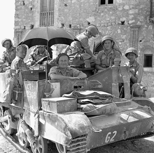 Infantrymen of the Edmonton Regiment in a Universal Carrier, using an umbrella to provide some shade.Photo: BiblioArchives/LibraryArchives CC BY 2.0