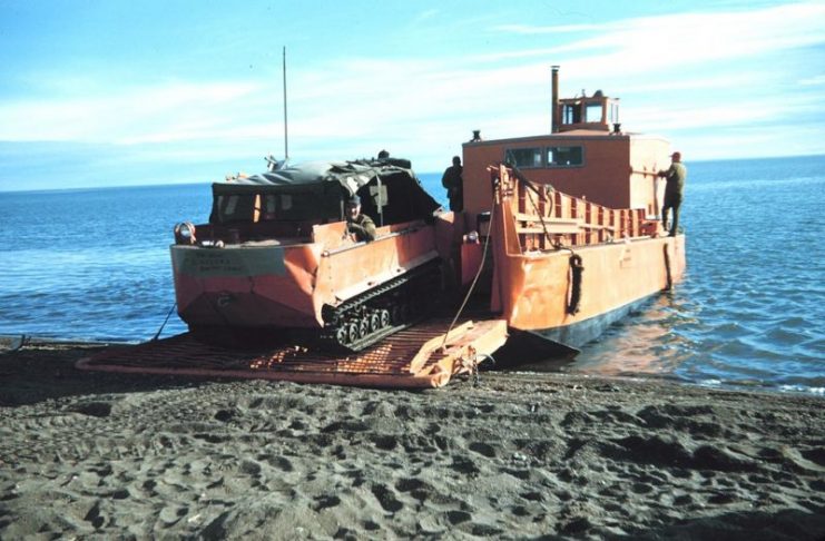 Loading a M-29 Weasel on the landing craft “Goldie”, Oliktok Point, Beaufort Sea coast, Alaska North Slope, Summer 1950 during construction of the DEW line.