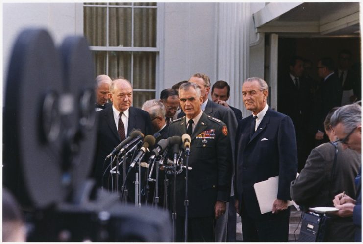 Press conference outside the White House in April 1968.Secretary of State Dean Rusk, General William Westmoreland, President Lyndon B. Johnson, others in background.