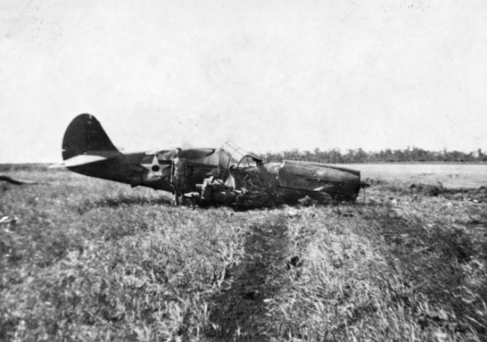 A crashed U.S. Army Air Force Curtiss P-40E Warhawk of the 33rd Pursuit Group (Provisional) at Darwin, Northern Territories (Australia). This was one of nine USAAF P-40s shot down during the Japanese Raid on Darwin on 19 February 1942.