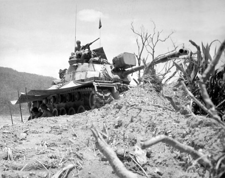 Tank in position to provide static road security, Vietnam