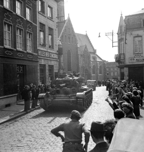 The crew of a Cromwell Mk IV tank of 2nd Welsh Guards on the drive into Brussels, September 3, 1944.