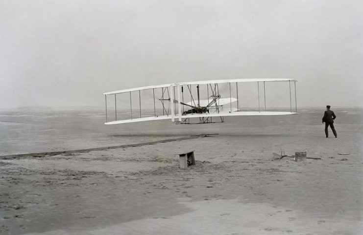 The first flight of an airplane, the Wright Flyer on December 17, 1903