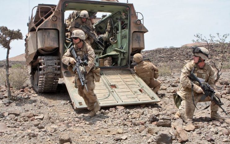 U.S. Marines dismounting from an Assault Amphibious Vehicle