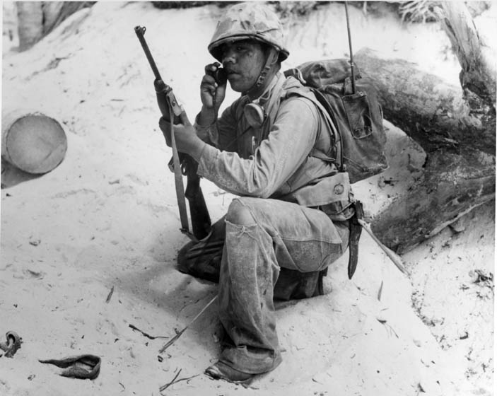 A Navajo Code Talker relays a message on a field radio. The code talkers served in the South Pacific during World War II and were kept a secret until 1968 when the Navajo code was finally declassified.