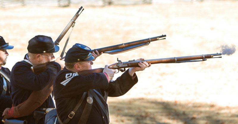 Men fire canon during Civil War Reenactment