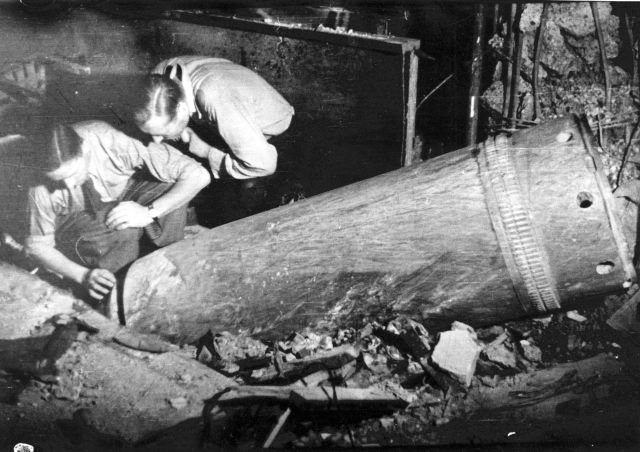 Warsaw Uprising- Sappers disarming a dud 600 mm mortar shell, which crashed through several stories and stopped in the basement of “Adria” townhouse at Moniuszki 10 street.