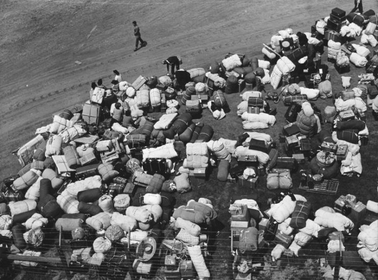 The baggage of Japanese Americans from the west coast, at a makeshift reception center located at a racetrack.