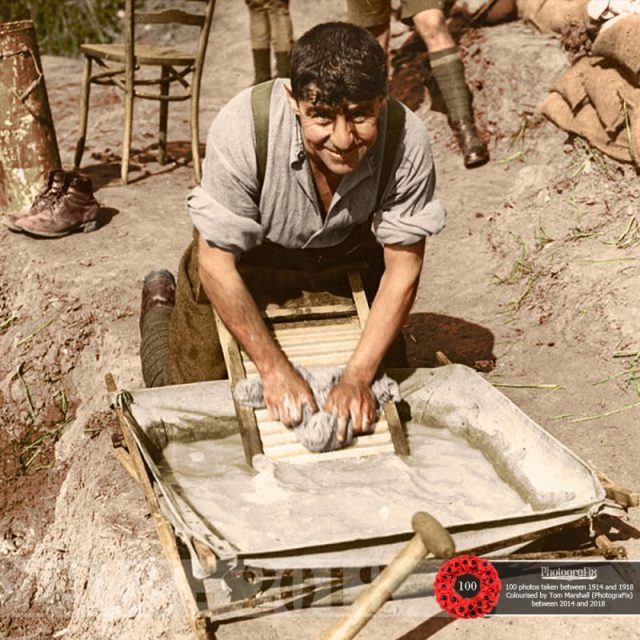 52. A soldier of the King’s Own Yorkshire Light Infantry washing clothes in an Officer’s canvas bath, Ypres-Comines Canal, 1 October 1917. Original image courtesy of the National Library of Scotland.