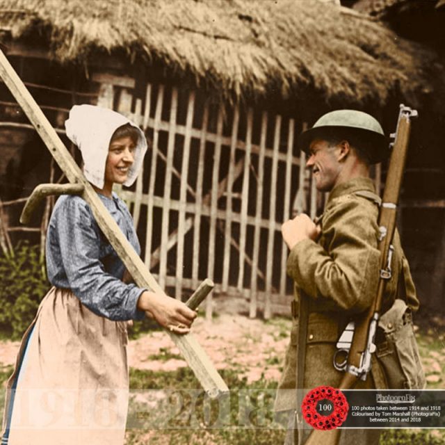 54. A British soldier talks to a local farm worker, somewhere in Passchendaele, 1917. Original image courtesy of the National Library of Scotland.