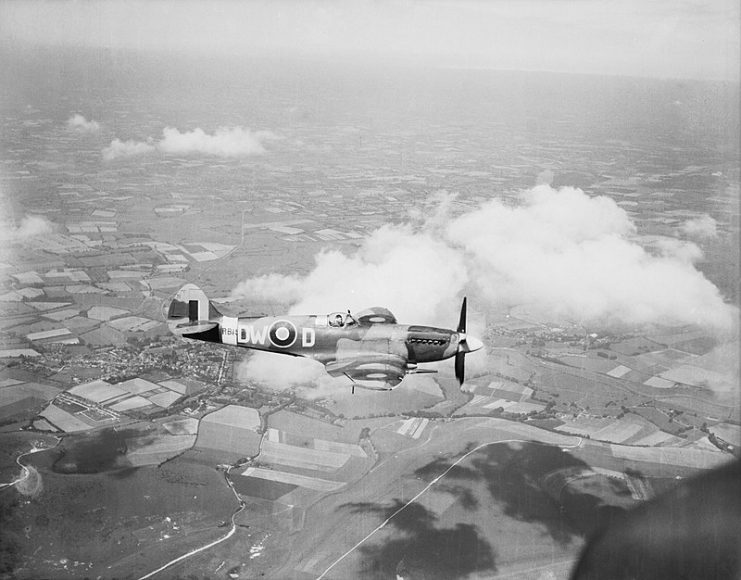 Spitfire F Mark XIV’, being flown by the commanding officer of No. 610 Squadron RAF, Squadron Leader R A Newbury, when based at Friston, Sussex.