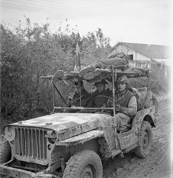 A jeep ambulance of the Royal Canadian Army Medical Corps (R.C.A.M.C.) bringing in two wounded Canadian soldiers on the Moro Riverfront, south of San Leonardo di Ortona, Italy, December 10, 1943. Photo: BiblioArchives / LibraryArchives CC BY 2.0