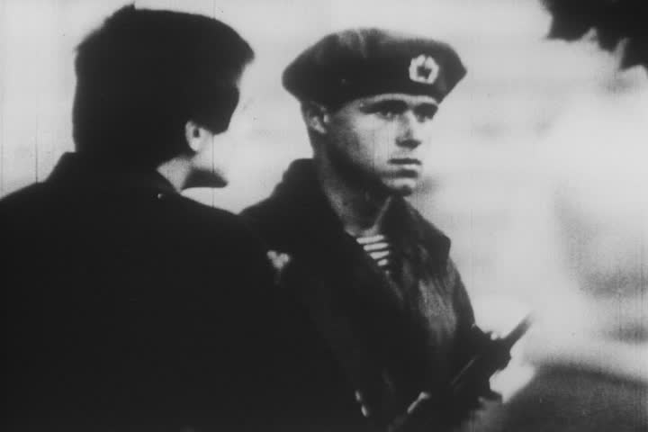 A Prague resident tries to talk with a Soviet soldier.