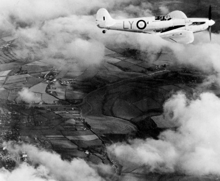 A Royal Air Force Supermarine Spitfire Mark I of No. 1 Photographic Reconnaissance Unit RAF in flight. 1 PRU was based at Heston Aerodrome, wet of London (UK).