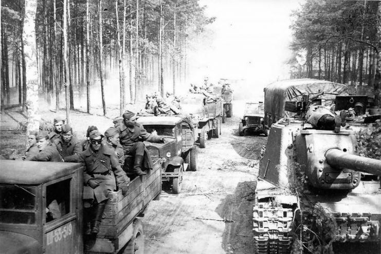 Assault gun ISU-152 and soviet trucks