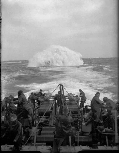 Depth charges detonate astern of the sloop HMS Starling. She participated in the sinking of 14 U-boats throughout the war.