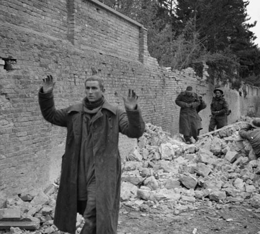 German soldiers surrendering to personnel of The Edmonton Regiment. Photo: BiblioArchives / LibraryArchives CC BY 2.0