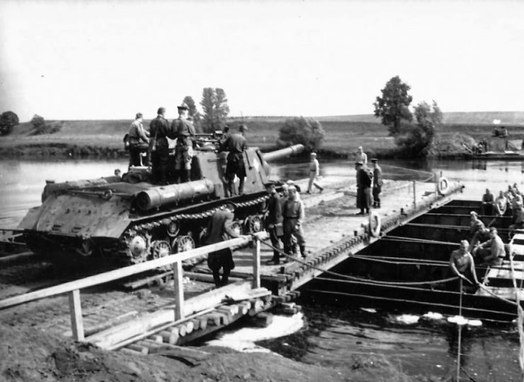 ISU-152 of the 1st Guards Tank Army passing a pontoon bridge