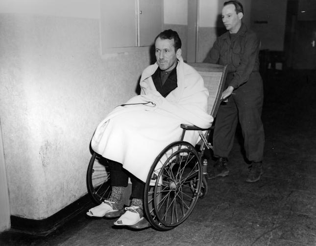 Kaltenbrunner wheeled into court during the Nuremberg trials after a brain haemorrhage during interrogation.