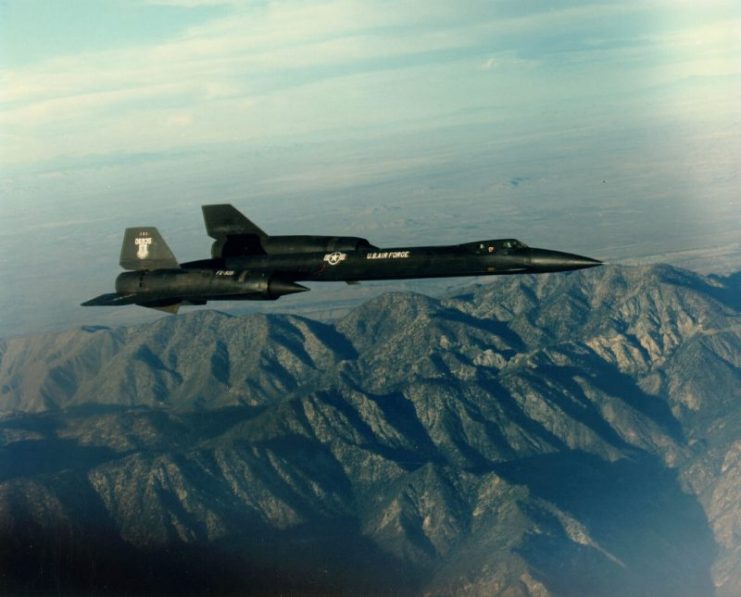 YF-12A overflying a mountain.