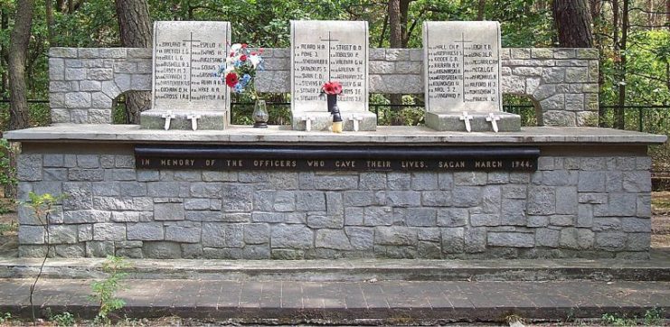 Memorial to “The Fifty” down the road toward Żagań. Memorial to “The Fifty” Allied airmen executed after the “Great Escape”.(Gunn is listed on the left tablet).